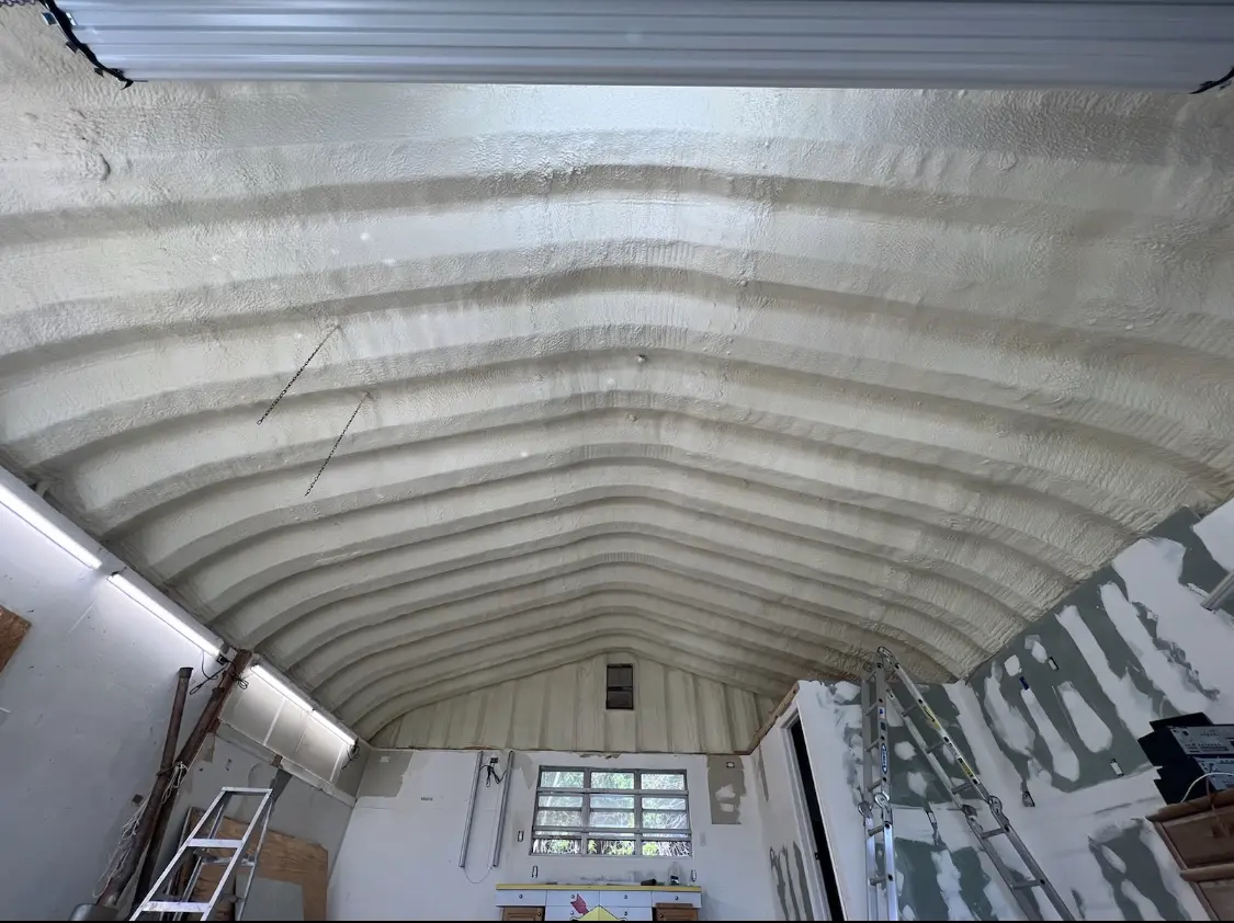 Spray polyurethane foam applied to the underside of a metal roof deck in Waldoboro